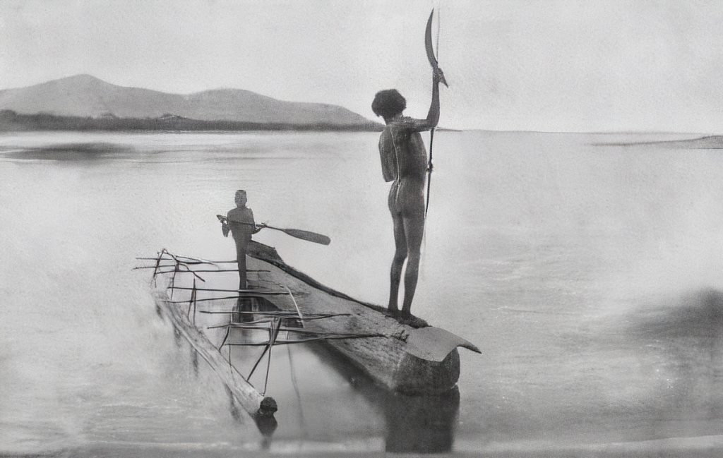 Two men on their outrigger canoe, fishing. Cairns, 1890s.