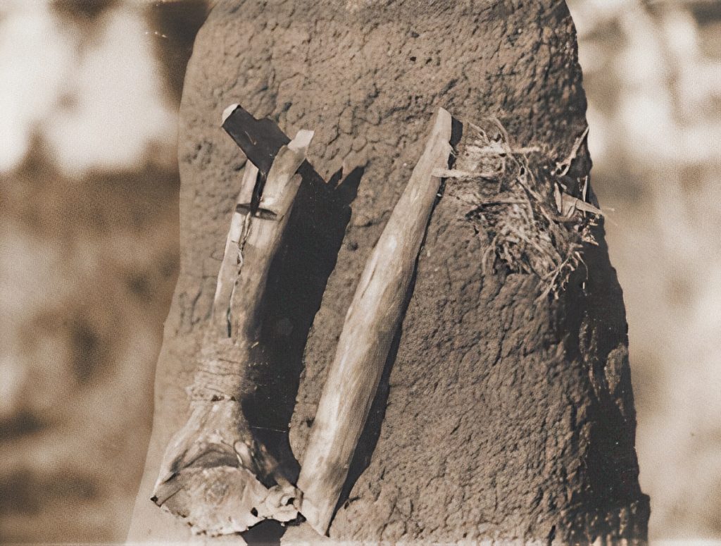 A fire saw with a cleft stick.